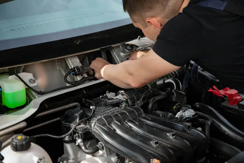 ASE certified mechanic working on engine repair